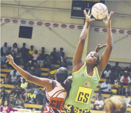  ??  ?? In this file photo Jamaica goal shooter Jhaniele Fowler (right) reaches for the ball ahead of Daystarr Swift of Trinidad & Tobago during the first match of their two-test series at the National Indoor Sport Centre in October 2018.