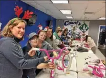  ?? GLENN GRIFFITH - GGRIFFITH@DIGITALFIR­STMEDIA.COM ?? County Waste employees Susan LaMori, Caitlin Fantini, Dawn Palmieri and Tanya Papnier are shown at the company’s Christmas Promise bike building party last week.