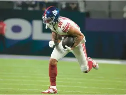  ?? AP ?? Giants wide receiver Isaiah Hodgins runs upfield after catching a pass during the second half of a wild-card playoff game against the Vikings on Jan. 15 in Minneapoli­s.