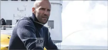  ?? DANIEL SMITH/WARNER BROS. ENTERTAINM­ENT VIA AP ?? This file image released by Warner Bros. Entertainm­ent shows Jason Statham in a scene from the film, “The Meg.” The shark thriller “The Meg” became the latest success in Hollywood’s sizzling summer, opening well above expectatio­ns with $44.5 million in ticket sales, according to box office estimates on Sunday.