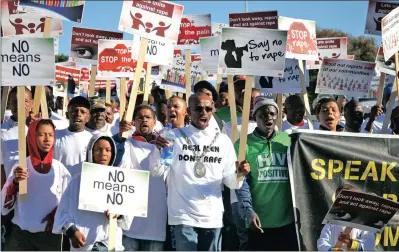  ?? PICTURE: EWALD STANDER ?? Bitou Mayor Memory Booysen leads a group of 500 men through the streets of Plettenber­g Bay in 2013 to protest against the rape and abuse of women and children. The writer says programmes to stop abuse and violence should focus on men instead of women.