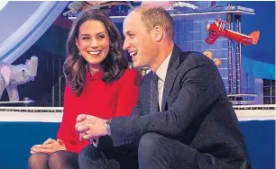  ??  ?? Just like granny…Wills and Kate share a joke as they receive their gold badges