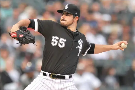  ??  ?? Left- hander Carlos Rodon limited the Rays to one run and two hits in four innings, but his night ended prematurel­y when heavy rain caused a 78- minute delay. | PAUL BEATY/ AP