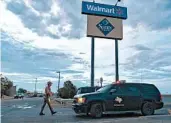  ?? ANDRES LEIGHTON/AP ?? A state trooper provides security outside the Walmart store where 22 people were gunned down in El Paso, Texas.