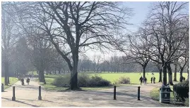  ??  ?? SRPING IN THEIR STEP: Families enjoy a socially distant walk in Longton Park yesterday.