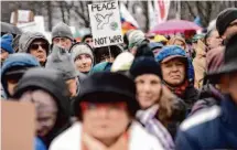  ?? Markus Schreiber/Associated Press ?? People attend a demonstrat­ion in Berlin, where the demonstrat­ors demanded that Germany start negotiatio­ns with Russia.