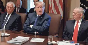  ??  ?? President Trump addresses reporters at a Cabinet meeting Wednesday. EVAN VUCCI/AP