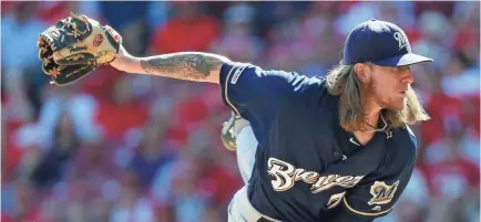  ?? MINCHILLO/AP JOHN ?? Brewers relief pitcher Josh Hader throws in the ninth inning of a game against the Reds on Thursday in Cincinnati.