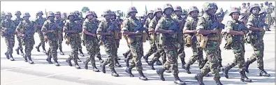  ?? ?? Members of the UEDF marching past ‘Their Majesties’ and guests during the Army Day final rehearsals yesterday.