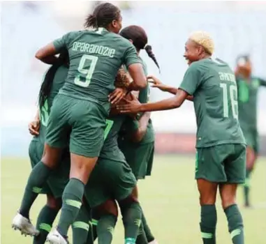  ??  ?? Super Falcons players celebrate after scoring against Equatorial Guinea in their last group B match at the 2019 AWCON in Ghana. The Falcons yesterday qualified for Saturday’s finals after beating Cameroon 4-2 on penalties.