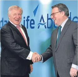  ??  ?? Aberdeen Asset Management’s Martin Gilbert and Keith Skeoch of Standard Life seal the deal.