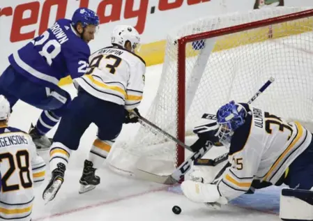  ?? BERNARD WEIL/TORONTO STAR ?? Leaf Connor Brown tucks the puck past Sabres defenceman Victor Antipin but not goalie Linus Ullmark in the first period of their first-ever game at Ricoh Coliseum on Friday night. The teams meet again tonight in Buffalo.