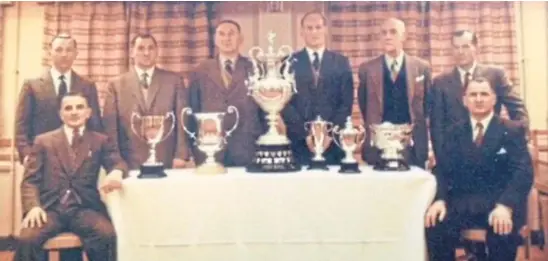  ??  ?? Dundee bakers with their silverware following a show triumph in the late 1950s. Back row: Dunc Robertson, George Duncan, Charlie Knight, Alec Martin, Willie Moonie and Bob Stenhouse. Danny Brown is front left with TD Duncan front right. See left for the full story.