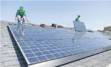  ?? THE ASSOCIATED PRESS ?? Installati­on firm SolarCity was bought last year by Tesla Inc. for US$2 billion in a move that could boost brand recognitio­n and cut the cost of acquiring new customers.