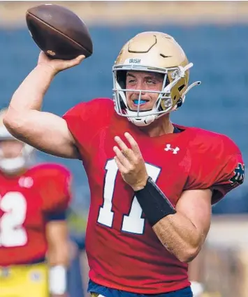  ?? MICHAEL CATERINA/SOUTH BEND TRIBUNE ?? QB Jack Coan started 18 games for Wisconsin before transferri­ng to Notre Dame.