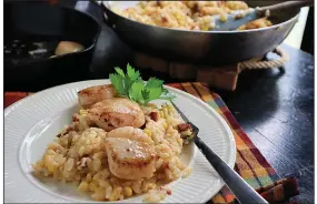  ?? (TNS/Pittsburgh Post-Gazette/Gretchen McKay) ?? Seared scallops on top of corn and chorizo risotto is an easy and satisfying fall dish.