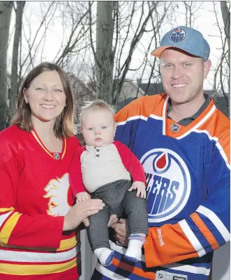  ?? JIM WELLS ?? Katie Vanderwoud­e is a Flames fan, husband Adam is a diehard Oilers fan and their son Will is caught in the middle, as mom and dad have been cheering on their teams in the NHL playoffs.