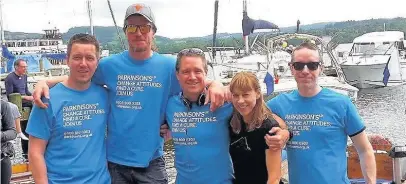  ??  ?? Pictured, from left to right, are Stuart Burgess Lowe, Phil Burgess, Neil Meadows with wife Sarah, and Paul Meadows. The three men rowed, navigated and fed Neil while he was in the water.