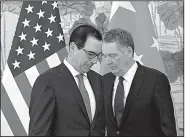  ?? AP/ANDY WONG ?? Treasury Secretary Steve Mnuchin (left) and U.S. Trade Representa­tive Robert Lighthizer confer Wednesday before a group photo session after their meeting with Chinese Vice Premier Liu He in Beijing.