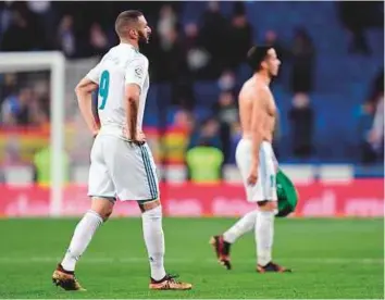  ?? AFP ?? Real Madrid’s French forward Karim Benzema leaves the field at the end the Spanish ‘Copa del Rey’ quarter-final defeat to Leganes at the Santiago Bernabeu stadium in Madrid.