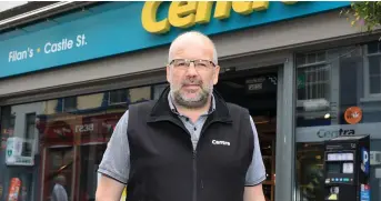 ??  ?? Finbarr Filan outside his Centra store on Castle St.