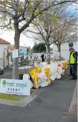  ??  ?? Tree Crops members with the apple tree varieties on sale at Saturday’s Moggies Market.