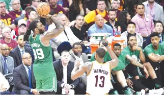  ??  ?? JAE CROWDER of the Boston Celtics shoots against Tristan Thompson of the Cleveland Cavaliers in the second half during Game Three of the 2017 NBA Eastern Conference Finals at Quicken Loans Arena on May 21 in Cleveland, Ohio.