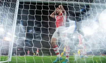  ?? Photograph: Justin Setterfiel­d/Getty Images ?? Kieran Tierney looks dejected after Diogo Jota scores in Liverpool’s 2-0 win at the Emirates; they have 75 goals to Arsenal’s 43 this season.