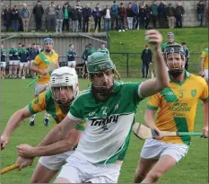  ??  ?? Barry Kehoe (Cloughbawn) breaking away from Harry Goff and Anthony Wallace (Shamrocks) in The Courtyard Ferns IHC quarter-final.