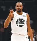  ?? KEVORK DJANSEZIAN — GETTY IMAGES ?? Kevin Durant celebrates during the NBA All-Star Game. Durant was among four Warriors in the entertaini­ng contest.