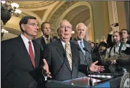  ?? AP/J. SCOTT APPLEWHITE ?? Senate Majority Leader Mitch McConnell on Tuesday discusses the Senate vote to start debate on a health care repeal bill. With him are Republican Sens. John Barrasso of Wyoming, John Thune of South Dakota and Majority Whip John Cornyn of Texas.