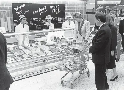  ?? ?? ● Princess Diana, The Princess of Wales, takes a shopping trolley around Tesco at Southport, Merseyside, where she shared advice on healthy eating.in 1990