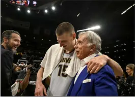  ?? AARON ONTIVEROZ — THE DENVER POST ?? Denver’s Nikola Jokic celebrates with team governor Josh Kroenke, left, and team owner Stan Kroenke after the Nuggets’ 113-111 Western Conference Finals victory over the Los Angeles Lakers at Crypto.com Arena in Los Angeles on Monday night.
