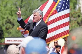  ?? STEVE SISNEY/THE OKLAHOMAN ?? In this April 2016 photo, evangelist Franklin Graham leads a prayer rally as part of his Decision America Tour stop on the grounds of the Oklahoma State Capitol in Oklahoma City.