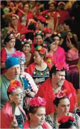  ??  ?? In this photo, dozens of Frida lookalikes stand in line during an attempt to break the Guinness World Record for the largest gathering of people dressed as Frida Kahlo in one location at the Dallas Museum of the Art in Dallas. — AP