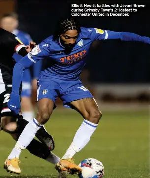  ??  ?? Elliott Hewitt battles with Jevani Brown during Grimsby Town’s 2-1 defeat to Colchester United in December.