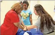  ?? File / Rome News-Tribune ?? This year’s Health Initiative will include lots of informatio­n and services — like CPR instructio­n Cynthia Brown is being taught during the 2016 event by Rachel Graham while Brown’s daughter Melinda Brown watches.