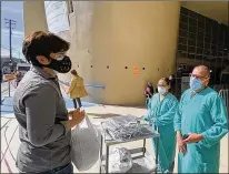  ?? WENDY FRY / SAN DIEGO UNION-TRIBUNE ?? GEMINI founder Jose Luis Ascolani delivers personal protection equipment like masks and coveralls to doctors at IMSS-20, a federal public hospital in Tijuana designated to treat coronaviru­s patients.