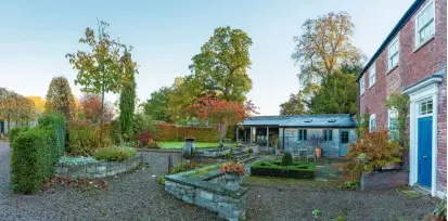  ??  ?? The clipped box parterre adds structure and interest to the terrace at the front of the house.