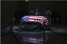  ?? GABRIELLE LURIE — SAN FRANCISCO CHRONICLE VIA AP ?? Mayor London Breed prays over the casket of Senator Dianne Feinstein at San Francisco City Hall before a public viewing on Wednesday.