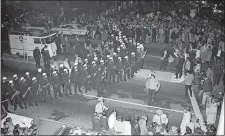  ?? AP PHOTO ?? Left, Oakland police face anti-Vietnam protesters marching from the University of California in Berkeley, Calif., in 1965.