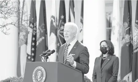  ?? ALEX BRANDON/AP ?? With Vice President Kamala Harris looking on, President Joe Biden speaks about the American Rescue Plan, the $1.9 trillion coronaviru­s relief package he signed into law this week, during an event Friday at the Rose Garden.