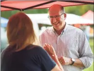  ?? Brian A. Pounds / Hearst Connecticu­t Media ?? Republican candidate for Trumbull first selectman, Mark Block, chats with voters at the Nichols Farmers Market in Trumbull on Oct. 14.