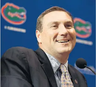  ?? ROB FOLDY/GETTY IMAGES ?? New UF football coach Dan Mullen addresses the media at his introducto­ry press conference Monday in Gainesvill­e. A former offensive coordinato­r at UF, Mullen said coaching the Gators is “something special.”