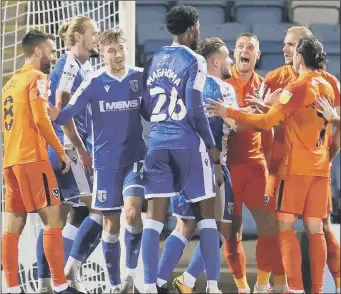  ?? Pictures: Nigel Keene Pictures: Nigel Keene ?? GETTING HEATED Tempers flare, above, between the two sets of players; Pompey playmaker Marcus Harness, above left, holds off Gillingham defender Declan Drysdale; and Michael Jacobs, left, takes aim at the home goal.