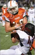  ??  ?? Portervill­e High School's Mark Inman attempts to run down field after receiving a pass Friday.