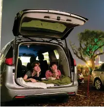  ?? MATIAS J. OCNER mocner@miamiheral­d.com ?? One of the many benefits to living in South Florida is an open-air drive-in movie in January. Flipp Posner, left, and Chandler Jaffe watch ‘Suspiria’ at the Nite Owl Drive-In theater in downtown Miami.