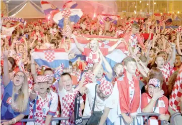  ?? — Reuters photo ?? Croatia’s fans celebrate after the match.