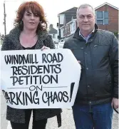  ??  ?? Residents Caroline Gormley from Windmill Road and Gerard Donnelly, Anneville Crescent, at the Windmill Road parking protest.