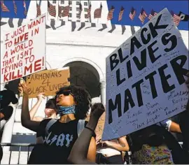  ?? Gary Coronado Los Angeles Times ?? THE BIGGEST demonstrat­ion took place in the region at the Civic Center, where thousands barely broke their stride as an earthquake occurred.